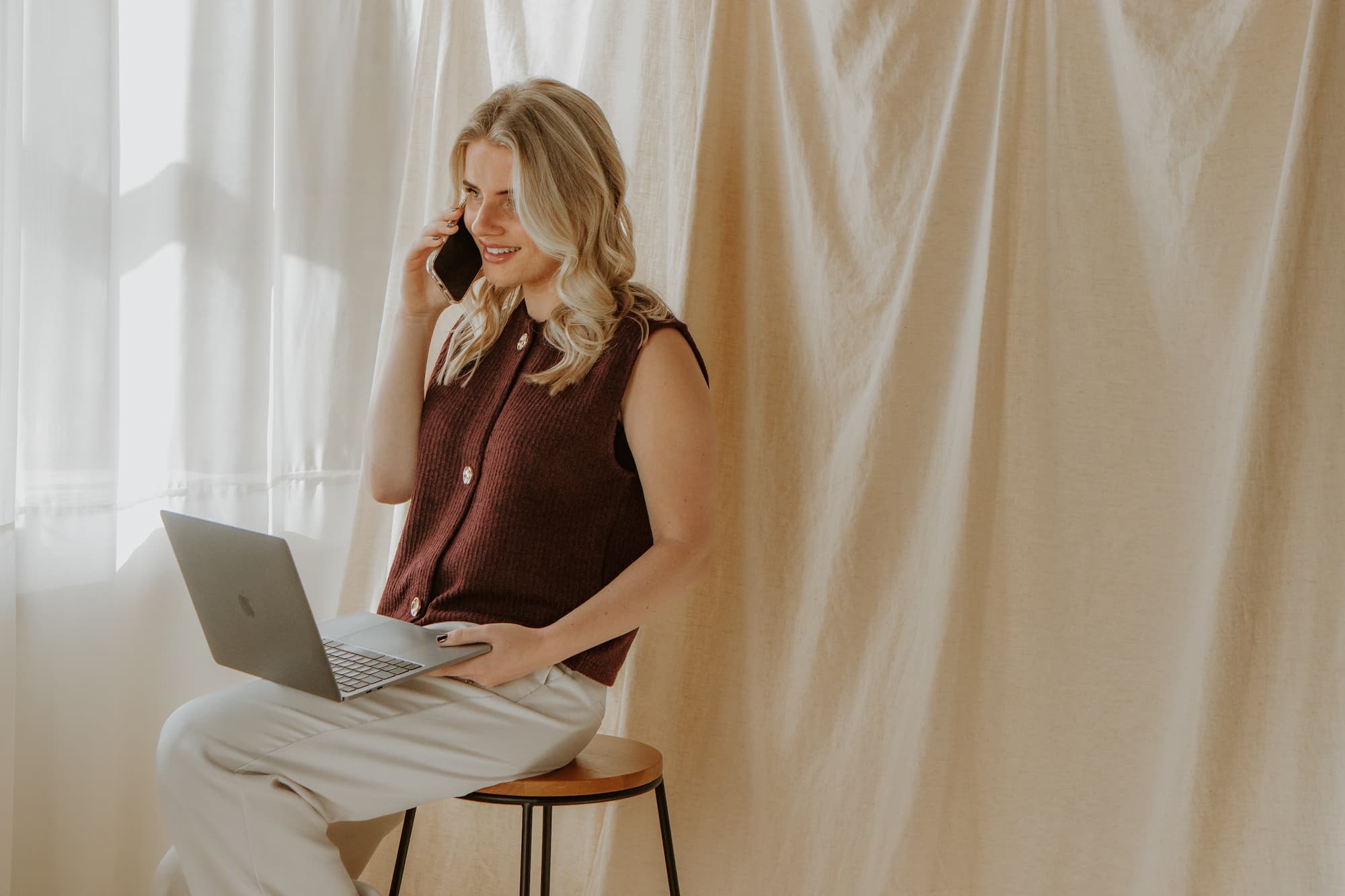 Romany on the phone with a client